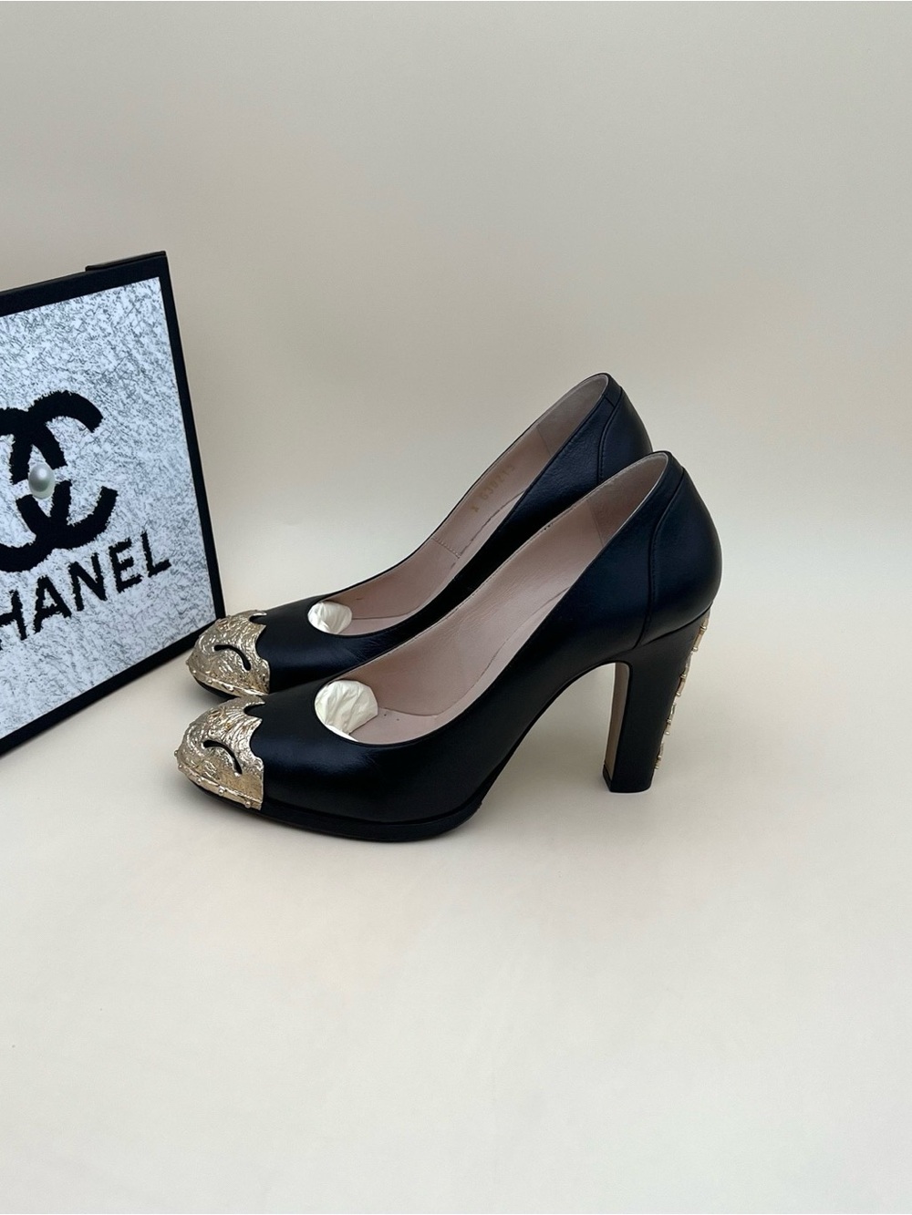 CHANEL Black Leather Pumps with Gold Decorative Cap-Toe